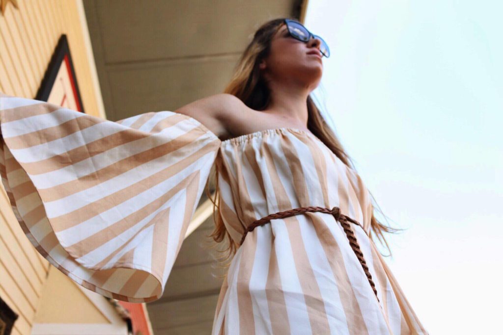 Summertime means it is time to flaunt your shoulders! This striped dress from Farai is the perfect eco way to do it.